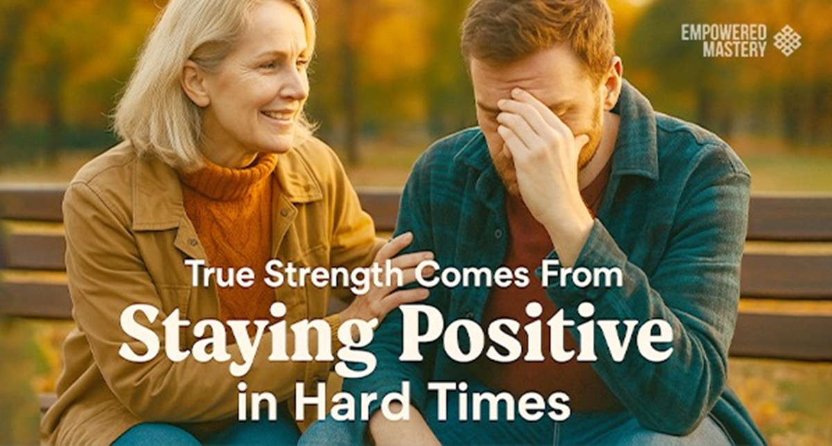 Woman comforting a stressed man on a bench. "True Strength Comes From Staying Positive in Hard Times" text overlay.