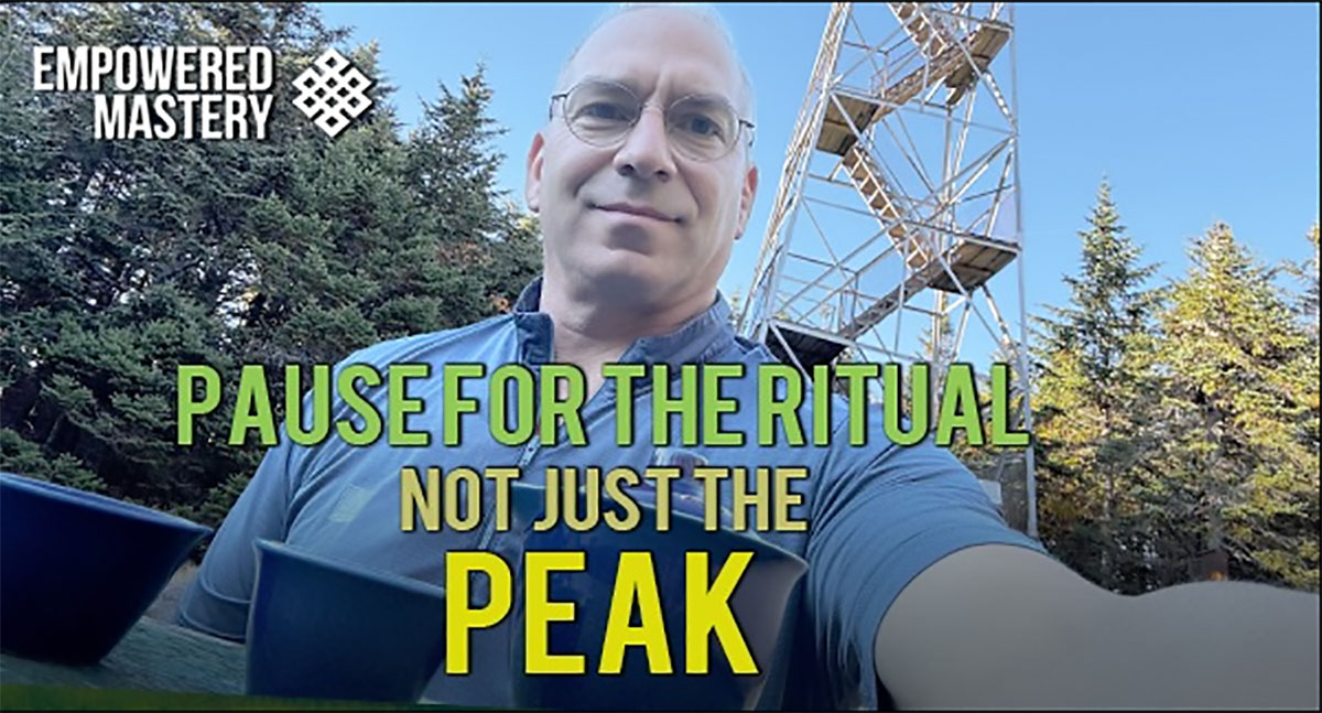 Chris outdoors with tower in background. "Pause for the Ritual, Not Just the Peak" text overlay.